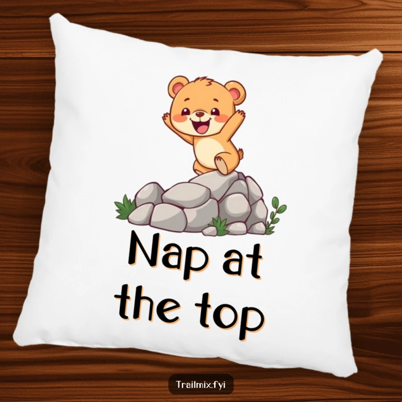 Funny bear cub pillow featuring a cheerful character enthusiastically climbing a rocky trail, offering comfort and a touch of outdoor fun.