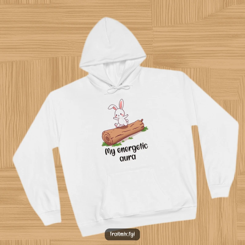 Funny energetic bunny character enthusiastically skipping over a fallen log, depicted on a soft, warm hoodie.