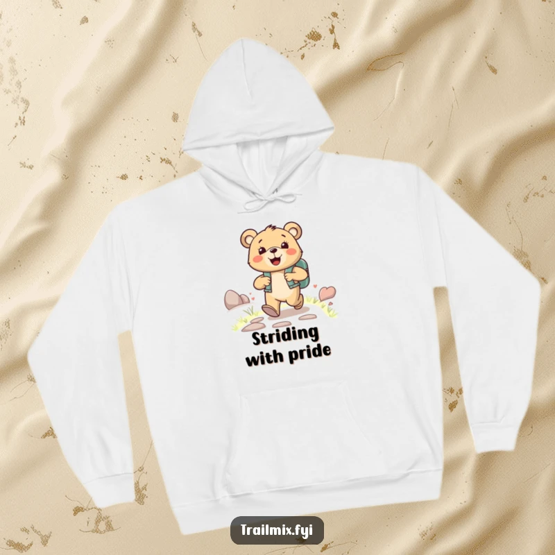 Funny happy bear character wearing a backpack, joyfully striding up a path, on a warm and funny hoodie.
