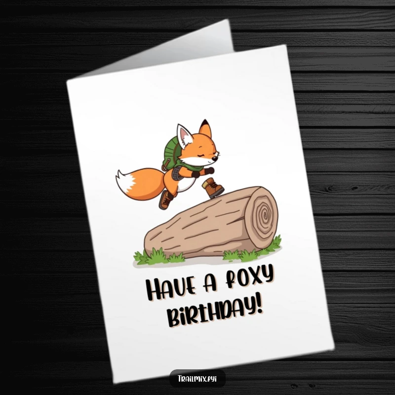 Funny Free Printable Birthday Card: Playful fox in hiking boots gracefully leaps over a fallen log, celebrating.