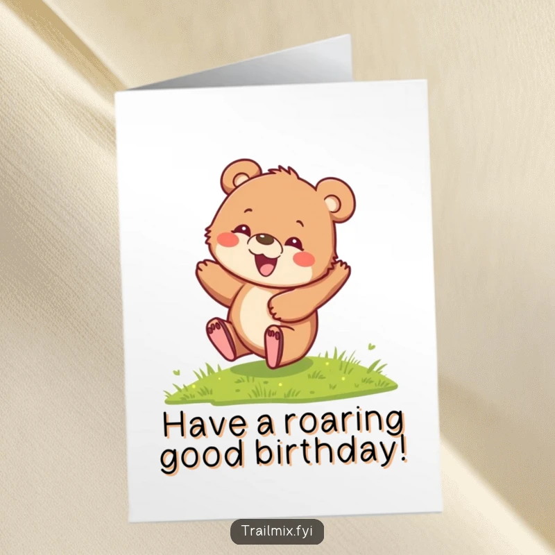 Funny Free Printable Birthday Card: A playful bear cub with a delighted expression rolls down a grassy hill.