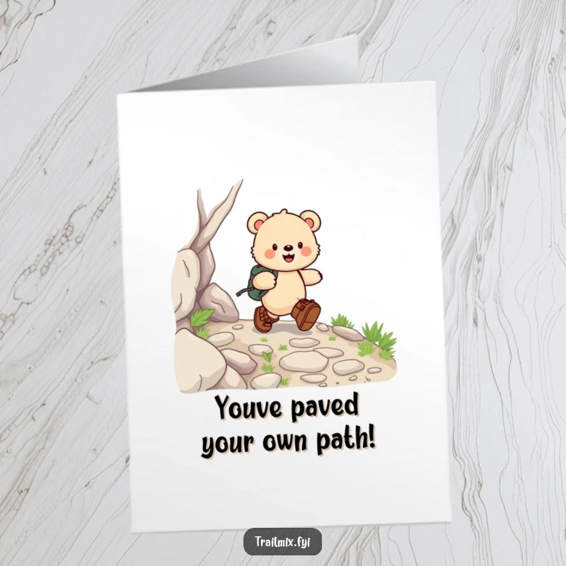 Free Printable Congratulations Card: A happy bear cub in hiking boots skips down a rocky path, celebrating success.