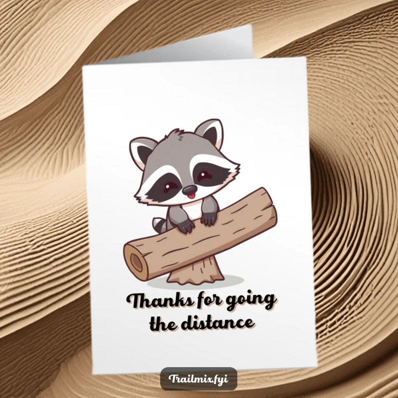 Funny Free Printable Thank You Card: A playful raccoon comically trying to balance on a log, offering thanks with a humorous effort.