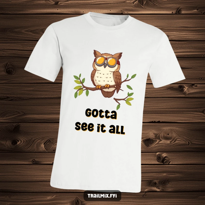 Funny t-shirt of a brave owl wearing goggles surveying the trail from a high branch, perfect for outdoor enthusiasts.