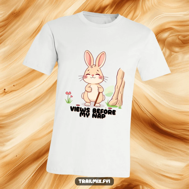 Funny t-shirt: a smiling, tired rabbit with a walking stick pausing to admire a mountain view, showcasing post-adventure humor.