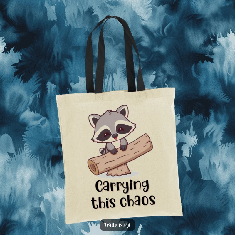 Funny tote bag featuring a playful cartoon raccoon comically attempting to balance on a log, showcasing precarious fun.
